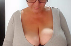 Busty cougar is teasing men with her huge boobs